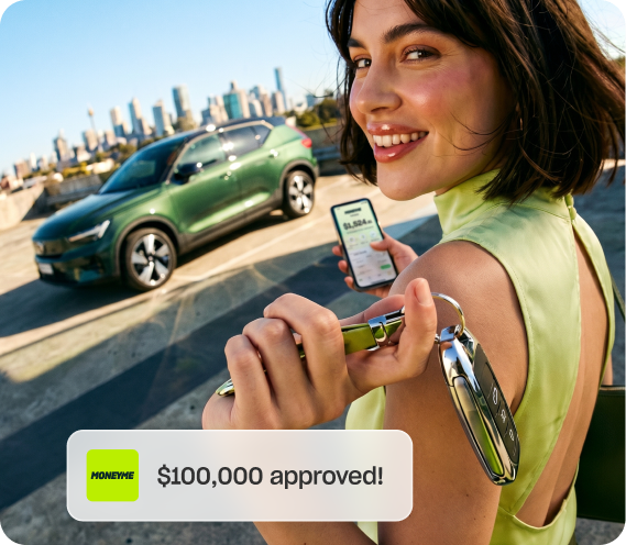 Woman holding her car keys in front of her new car