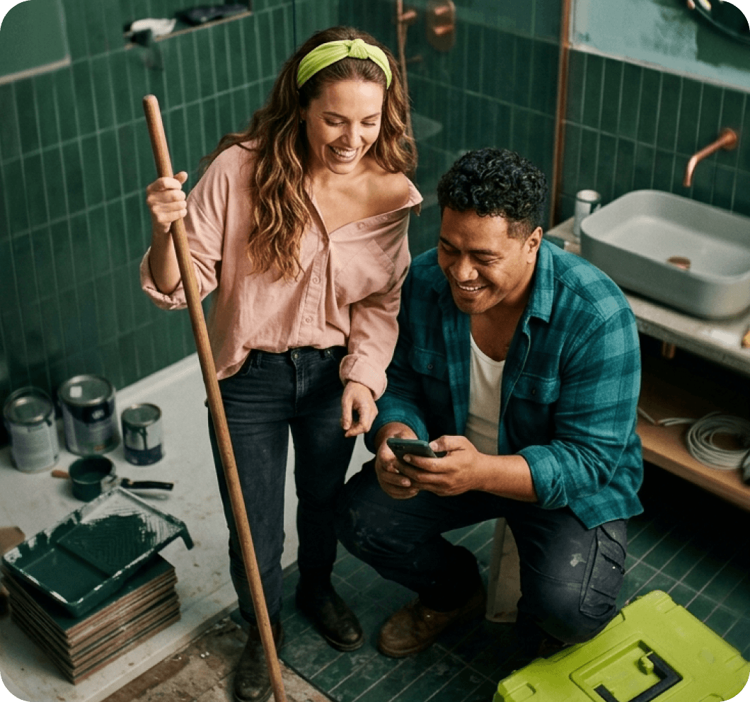 Man checking his personal loan rate on his phone at home
