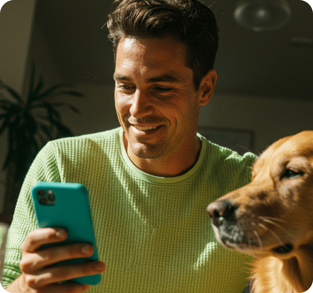 Man checking his personal loan rate on his phone at home